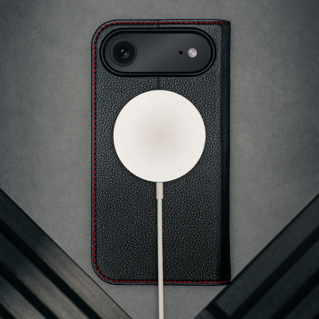 MagSafe charger attached to the Black (with Red detail) Leather Case for iPhone 17 Air