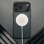 MagSafe charger attached to the Slimline Black Leather Bumper Case for iPhone 17 Pro