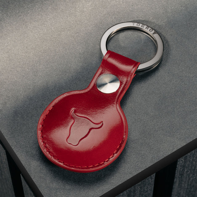 Back of the Red Leather Apple AirTag Holder Keyring showing TORRO bulls head logo