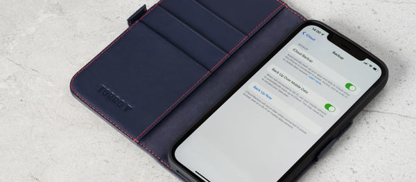 Navy Blue TORRO iPhone Case with iPhone. Screen showing the iCloud backup settings page.