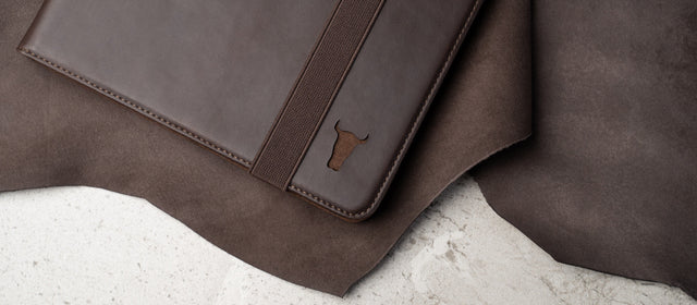 Dark Brown iPad Case sitting on a leather hide