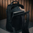 Large spacious storage compartment of the Black Leather Backpack with MacBook and Clothes stored