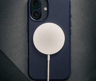 MageSafe charger connected to the Blue Leather Slimline Bumper Case for iPhone 16