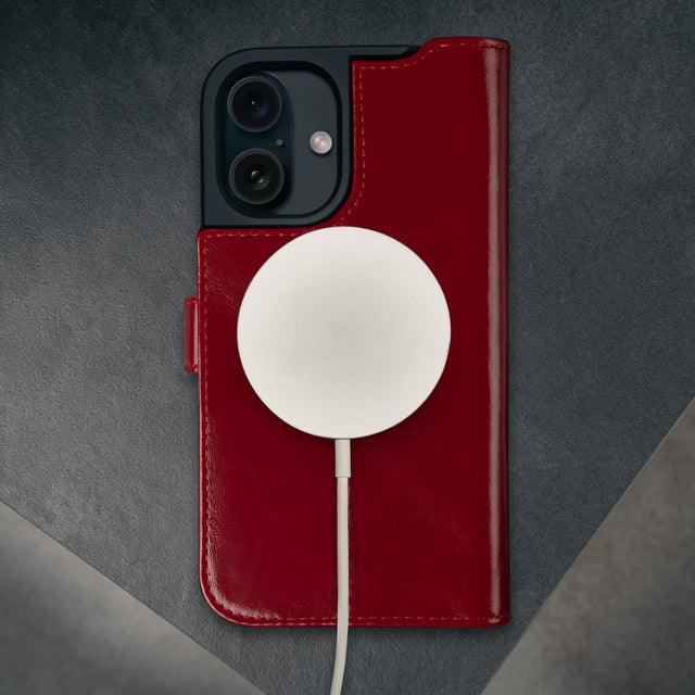 MagSafe charger connected to the Red Leather Case for iPhone 16