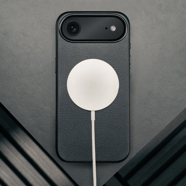 MagSafe charger attached to the Black Leather Bumper Case for iPhone 17 Air