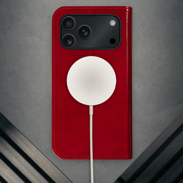 MagSafe charger attached to the Red Leather Case for iPhone 17 Pro