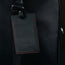 Black with Red Stitching Leather Luggage Tag attached to luggage