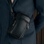 Black Leather Phone Bag worn over a model's shoulder