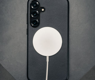 MagSafe charger attached to the Black Slimline Leather Bumper Case for Galaxy S25