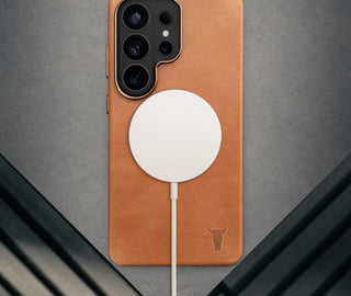 Wireless charger attached to. theTan Leather Bumper Case for Galaxy S26 Ultra