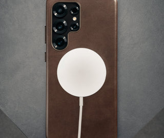 MagSafe charger attached to the Dark Brown Slimline Leather Bumper Case for Galaxy S25 Ultra