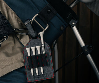 Black with Red Detail Leather Golf Tee Holder with 4 TORRO tees, attached to golf bag