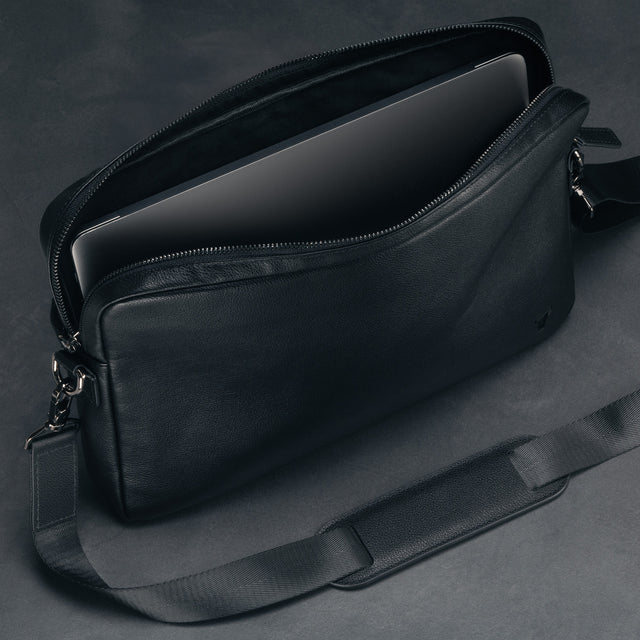 Protective leather flap on the inside of the Black Leather Messenger Bag