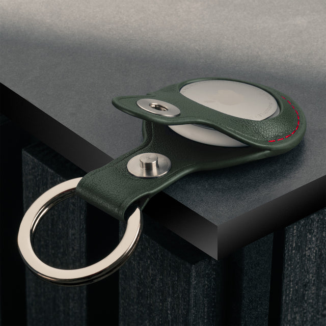 Close up of the Green with Red Detail Leather Apple AirTag Holder Keyring