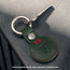 Green with Red Detail Leather Apple AirTag Holder Keyring attached to key