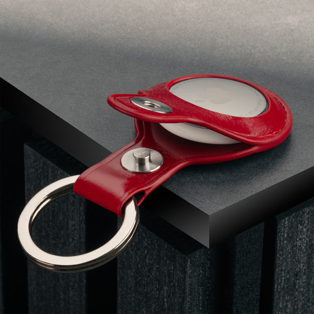 Close up of the press stud clasp on the Red Leather Apple AirTag Holder Keyring