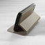 Stand function of the Taupe Leather Bumper Case (with detachable cover) for iPhone 14 Pro Max