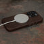 MagSafe charger attached to the Dark Brown Slimline Leather Bumper Case for iPhone 15 Pro