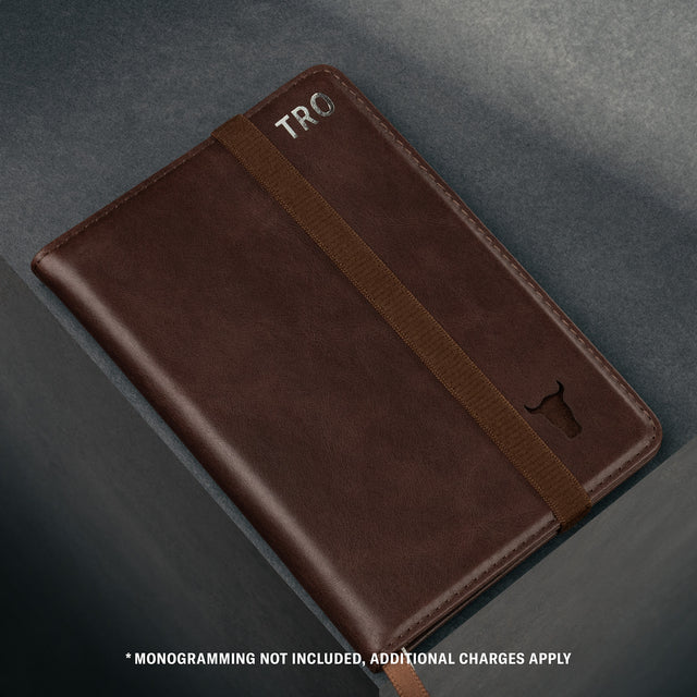 Close up of the TORRO bulls head logo on the Dark Brown Leather Passport holder